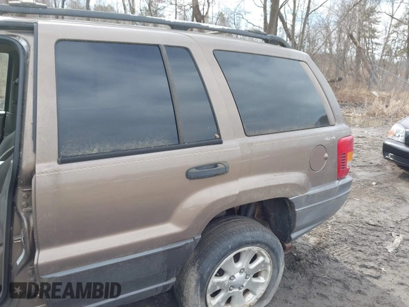2001 Jeep Grand Cherokee Laredo with VIN 1J4GW48SX1C658610, listed as a IAAI auction lot 41831013 with 200,142 mi miles and . Bid and sale history available at DreamBid. Image 6.