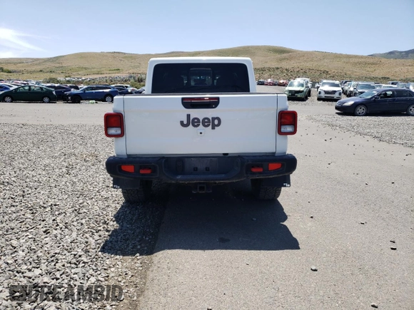2022 Jeep Gladiator Rubicon z VIN 1C6JJTBG4NL135430, wystawiony jako Copart lot #52581015 z przebiegiem 54 553 mil mil oraz Szkoda całkowita • Salvage title. Historia ofert i sprzedaży dostępna na DreamBid. Obrazek 6.