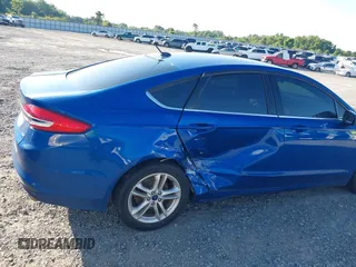 2018 Ford Fusion SE z VIN 3FA6P0H7XJR106776, wystawiony jako IAAI lot #42243361 z przebiegiem 174 000 mil mil oraz . Historia ofert i sprzedaży dostępna na DreamBid. Obrazek 6.