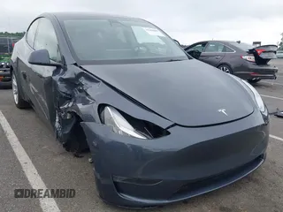 2023 Tesla Model Y Long Range z VIN 7SAYGDEE7PA121470, wystawiony jako IAAI lot #42258805 z przebiegiem 9 037 mil mil oraz . Historia ofert i sprzedaży dostępna na DreamBid. Obrazek 1.