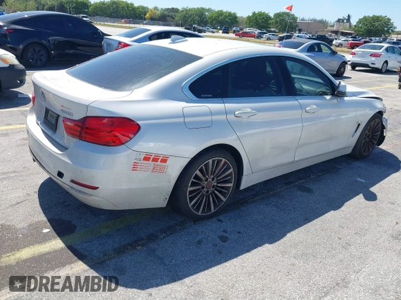 2015 BMW 4 Series 428i with VIN WBA4A5C58FGK15335, listed as a IAAI auction lot 41723243 with 152,652 mi miles and . Bid and sale history available at DreamBid. Image 4.