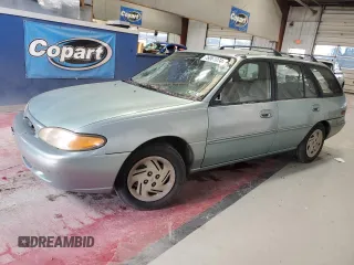 1997 Ford Escort LX with VIN 3FALP15P9VR107467, listed as a Copart auction lot 76061074 with 69,873 mi miles and Clean Title. Bid and sale history available at carsss.com. Image 1.