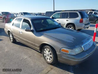 2003 Ford Crown Victoria LX with VIN 2FAFP74W53X153885, listed as a IAAI auction lot 41494382 with 233,666 mi miles. Bid and sale history available at carsss.com. Image 1.