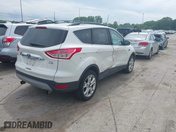 2013 Ford Escape SEL with VIN 1FMCU9H90DUC52981, listed as a IAAI auction lot 42506500 with 74,212 mi miles and . Bid and sale history available at DreamBid. Image 4.