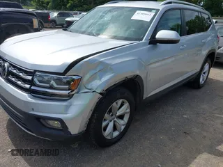 2018 Volkswagen Atlas SE z VIN 1V2DR2CAXJC521412, wystawiony jako IAAI lot #42309661 z przebiegiem 99 045 mil mil oraz . Historia ofert i sprzedaży dostępna na DreamBid. Obrazek 6.