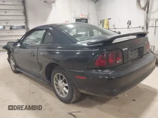 1997 Ford Mustang with VIN 1FALP4041VF157548, listed as a IAAI auction lot 39894591 with 146,891 mi miles. Bid and sale history available at carsss.com. Image 3.