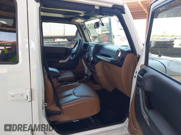 2016 Jeep Wrangler Unlimited Sahara with VIN 1C4BJWEG0GL126270, listed as a IAAI auction lot 42229364 with 50,847 mi miles and . Bid and sale history available at DreamBid. Image 5.