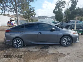 2018 Toyota Prius Plus with VIN JTDKARFPXJ3104302, listed as a IAAI auction lot 42127312 with 87,531 mi miles and . Bid and sale history available at DreamBid. Image 14.