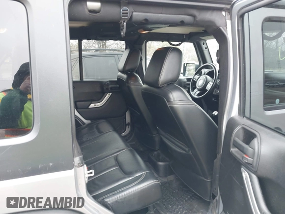 2013 Jeep Wrangler Unlimited Rubicon z VIN 1C4BJWFG7DL667083, wystawiony jako IAAI lot #42016912 z przebiegiem 148 933 mil mil oraz . Historia ofert i sprzedaży dostępna na DreamBid. Obrazek 8.