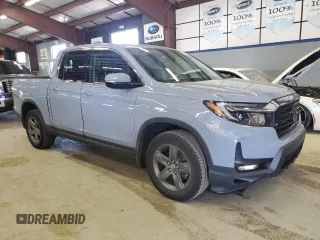 2023 Honda Ridgeline RTL-E with VIN 5FPYK3F77PB001460, listed as a Copart auction lot 61383785 with 27,423 mi miles and Salvage title. Bid and sale history available at DreamBid. Image 4.