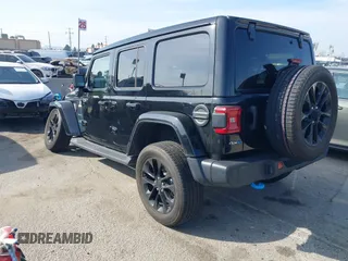 2023 Jeep Wrangler Sahara with VIN 1C4JJXP67PW556933, listed as a IAAI auction lot 41587035 with 20,463 mi miles and . Bid and sale history available at DreamBid. Image 3.