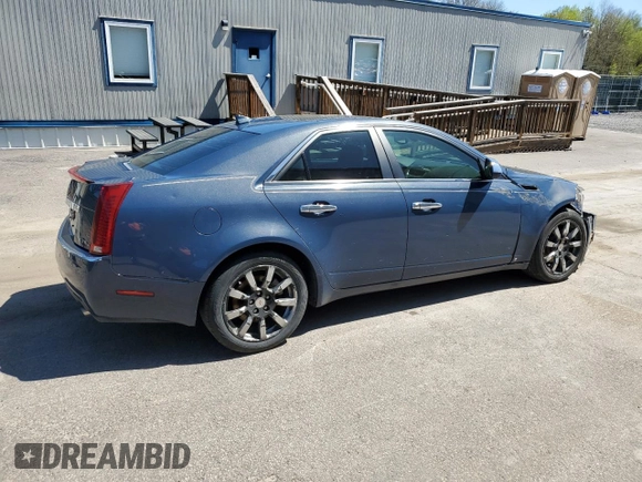 2009 Cadillac CTS AWD with VIN 1G6DH577390123365, listed as a Copart auction lot 54815885 with 141,026 mi miles and Salvage Title. Bid and sale history available at DreamBid. Image 3.
