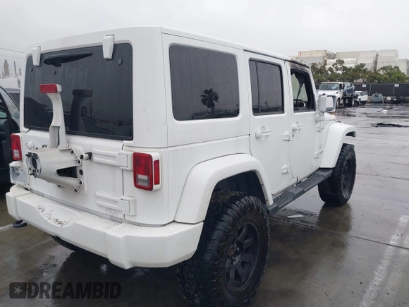 2016 Jeep Wrangler Unlimited Sahara with VIN 1C4HJWEG8GL240950, listed as a IAAI auction lot 41443059 with Not provided miles and . Bid and sale history available at DreamBid. Image 4.