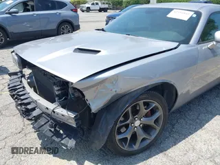 2015 Dodge Challenger SXT Plus z VIN 2C3CDZBG0FH715823, wystawiony jako IAAI lot #42354845 z przebiegiem 130 879 mil mil oraz . Historia ofert i sprzedaży dostępna na DreamBid. Obrazek 6.