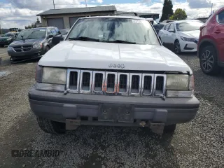 1994 Jeep Grand Cherokee Laredo with VIN 1J4GZ58Y2RC207099, listed as a Copart auction lot 71176114 with 127,110 mi miles and Salvage Title. Bid and sale history available at carsss.com. Image 5.