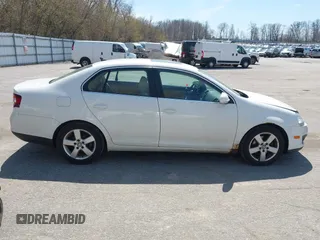 2009 Volkswagen Jetta SE z VIN 3VWRM71K99M057390, wystawiony jako IAAI lot #42094648 z przebiegiem 168 533 mil mil oraz . Historia ofert i sprzedaży dostępna na DreamBid. Obrazek 14.