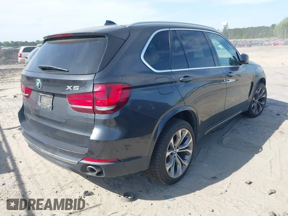 2014 BMW X5 xDrive35d with VIN 5UXKS4C57E0J93982, listed as a IAAI auction lot 42085173 with 169,908 mi miles. Bid and sale history available at carsss.com. Image 4.
