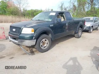 2005 Ford F-150 XLT with VIN 1FTPX14555NA51705, listed as a IAAI auction lot 42098365 with 162,409 mi miles. Bid and sale history available at carsss.com. Image 2.