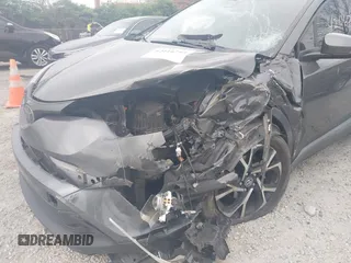 2018 Toyota C-HR XLE z VIN NMTKHMBX9JR044367, wystawiony jako IAAI lot #42116714 z przebiegiem 124 597 mil mil oraz . Historia ofert i sprzedaży dostępna na DreamBid. Obrazek 6.