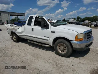 1999 Ford Super Duty F-250 XL with VIN 1FTNX20F2XEC42996, listed as a Copart auction lot 63616344 with 0 mi miles and Salvage Title. Bid and sale history available at carsss.com. Image 4.