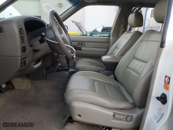 1999 Infiniti QX4 Luxury with VIN JNRAR07Y9XW067628, listed as a Copart auction lot 87859755 with 169,422 mi miles and Salvage Title. Bid and sale history available at carsss.com. Image 7.