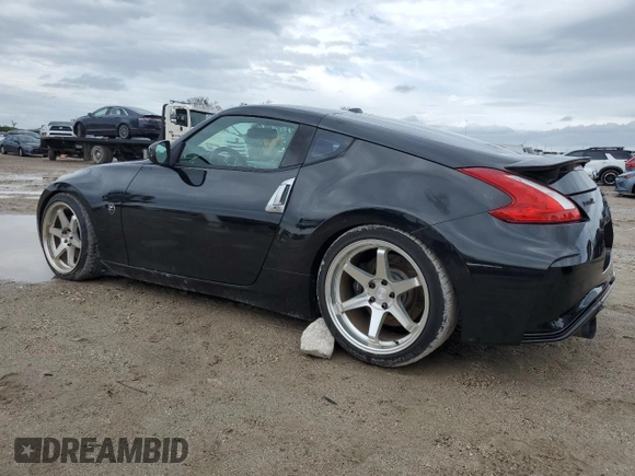 2009 Nissan 370Z Touring with VIN JN1AZ44E29M406023, listed as a Copart auction lot 73721324 with 108,072 mi miles and Salvage Title. Bid and sale history available at carsss.com. Image 2.
