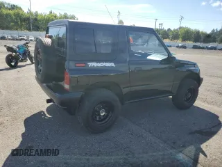 1998 Chevrolet Tracker z VIN 2CNBJ1868W6925819, wystawiony jako Copart lot #70881874 z przebiegiem 180 849 mil mil oraz Szkoda całkowita • Salvage title. Historia ofert i sprzedaży dostępna na DreamBid. Obrazek 3.