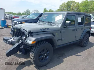 2021 Jeep Wrangler Unlimited Willys с VIN 1C4HJXDNXMW815548, выставлен на аукционе IAAI как лот 42226665 с пробегом 55 457 миль миль и . История ставок и продаж доступна на DreamBid. Изображение 2.
