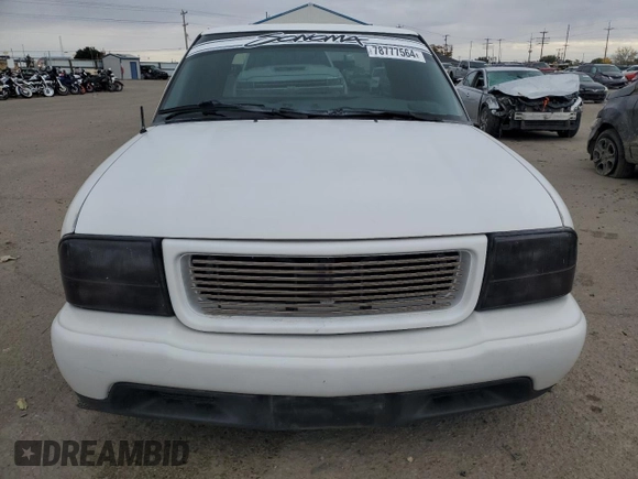 2000 GMC Sonoma SLS z VIN 1GTCS19W8Y8176036, wystawiony jako Copart lot #78777564 z przebiegiem 159 084 mil mil oraz Szkody całkowita. Historia ofert i sprzedaży dostępna na DreamBid. Obrazek 5.