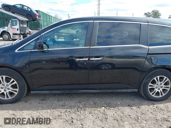 2011 Honda Odyssey EX with VIN 5FNRL5H4XBB011918, listed as a IAAI auction lot 42056043 with 201,821 mi miles and . Bid and sale history available at carsss.com. Image 14.
