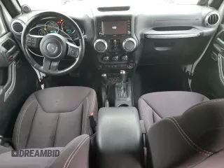 2013 Jeep Wrangler Unlimited Sahara with VIN 1C4HJWEG4DL562951, listed as a Copart auction lot 58001475 with 95,744 mi miles and Clean title. Bid and sale history available at DreamBid. Image 8.