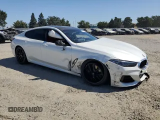 2023 BMW 8 Series M850i with VIN WBAGV8C0XPCK39846, listed as a Copart auction lot 61173594 with 0 mi miles and Salvage Title. Bid and sale history available at carsss.com. Image 4.