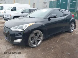 2013 Hyundai Veloster w/Black Int with VIN KMHTC6AD7DU170049, listed as a IAAI auction lot 42441737 with 101,924 mi miles and . Bid and sale history available at DreamBid. Image 2.