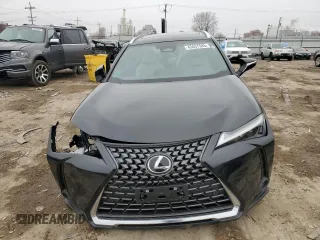 2025 Lexus UX with VIN JTHUCJDH5S2003058, listed as a Copart auction lot 43457505 with 1,239 mi miles and Salvage Title. Bid and sale history available at carsss.com. Image 5.