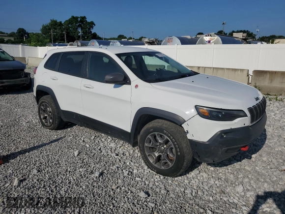 2020 Jeep Cherokee Trailhawk with VIN 1C4PJMBX8LD630827, listed as a Copart auction lot 61975455 with 142,716 mi miles and Clean title. Bid and sale history available at DreamBid. Image 4.
