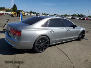 2012 Audi A8 z VIN WAURVAFD7CN023286, wystawiony jako Copart lot #56594745 z przebiegiem 199 443 mil mil oraz Czysty tytuł • Clean title. Historia ofert i sprzedaży dostępna na DreamBid. Obrazek 3.