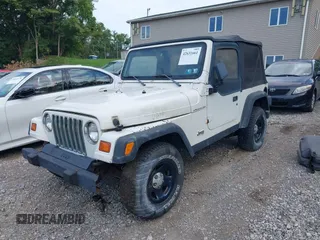 1998 Jeep Wrangler SE with VIN 1J4FY29P0WP792787, listed as a IAAI auction lot 42631661 with 190,180 mi miles and . Bid and sale history available at DreamBid. Image 2.