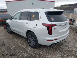 2021 Cadillac XT6 Premium Luxury with VIN 1GYKPFRS0MZ100879, listed as a IAAI auction lot 41083030 with 56,502 mi miles. Bid and sale history available at carsss.com. Image 3.