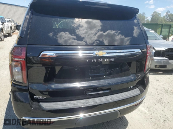 2021 Chevrolet Tahoe LT with VIN 1GNSKNKD4MR262628, listed as a Copart auction lot 54875235 with 90,533 mi miles and Salvage title. Bid and sale history available at DreamBid. Image 6.