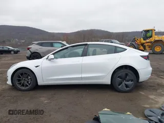 2020 Tesla Model 3 Standard Range Plus with VIN 5YJ3E1EA7LF659172, listed as a IAAI auction lot 42017026 with 32,104 mi miles. Bid and sale history available at carsss.com. Image 14.