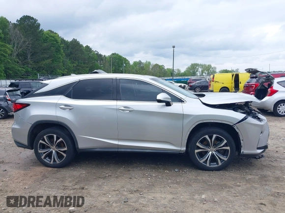 2016 Lexus RX 350 z VIN 2T2ZZMCA5GC002315, wystawiony jako IAAI lot #42107312 z przebiegiem 156 339 mil mil oraz . Historia ofert i sprzedaży dostępna na DreamBid. Obrazek 14.