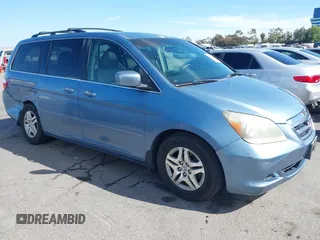 2006 Honda Odyssey EX-L z VIN 5FNRL38706B075356, wystawiony jako IAAI lot #42021960 z przebiegiem 120 455 mil mil oraz . Historia ofert i sprzedaży dostępna na DreamBid. Obrazek 1.