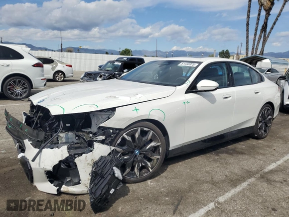 2024 BMW i5 eDrive40 with VIN WBY33FK04RCR92576, listed as a Copart auction lot 51180875 with 11,289 mi miles and Salvage title. Bid and sale history available at DreamBid. Image 1.