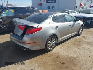 2014 Kia Optima EX z VIN 5XXGN4A74EG260054, wystawiony jako IAAI lot #41464688 z przebiegiem 40 498 mil mil oraz . Historia ofert i sprzedaży dostępna na DreamBid. Obrazek 4.