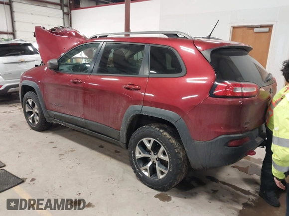 2015 Jeep Cherokee Trailhawk with VIN 1C4PJMBS7FW646577, listed as a IAAI auction lot 41404911 with 85,343 mi miles and . Bid and sale history available at DreamBid. Image 3.