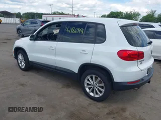 2014 Volkswagen Tiguan S with VIN WVGBV3AX0EW589381, listed as a IAAI auction lot 42186999 with 144,137 mi miles and . Bid and sale history available at DreamBid. Image 3.