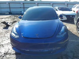 2023 Tesla Model 3 Long Range with VIN 5YJ3E1EB0PF688172, listed as a IAAI auction lot 41411580 with 21,125 mi miles and . Bid and sale history available at DreamBid. Image 6.