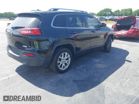 2015 Jeep Cherokee Latitude with VIN 1C4PJLCB4FW683904, listed as a IAAI auction lot 41579059 with 126,156 mi miles and . Bid and sale history available at carsss.com. Image 4.