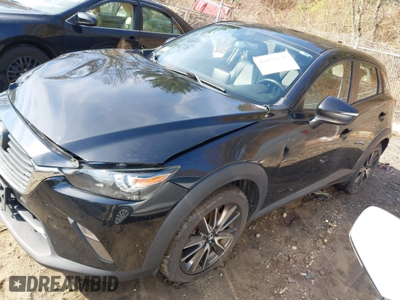 2017 Mazda CX-3 Touring with VIN JM1DKFC70H0171771, listed as a IAAI auction lot 41870395 with 100,472 mi miles. Bid and sale history available at carsss.com. Image 2.