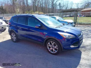 2014 Ford Escape Titanium with VIN 1FMCU9J98EUD22044, listed as a IAAI auction lot 41904017 with 148,473 mi miles. Bid and sale history available at carsss.com. Image 1.